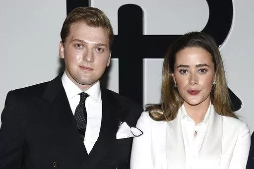 Naomi Biden, right, and fiancé Peter Neal attend the Ralph Lauren Fall/Winter 2022 fashion show at the Museum of Modern Art on Tuesday, March 22, 2022, in New York. Naomi Biden, the granddaughter of President Joe Biden, and Peter Neal are getting married on the South Lawn on Saturday in what will be the 19th wedding in White House history. (Photo by Evan Agostini/Invision/AP, File)