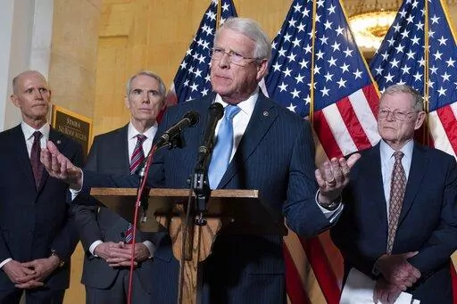 Sen. Roger Wicker, R-Miss., center, accompanied by Sen. Rick Scott, R-Fla., Sen. Rob Portman, R-Ohio, and Sen. Jim Inhofe, R-Okla. speaks during the Senate Armed Services and Senate Foreign Relations GOP news conference on Capitol Hill in Washington, Wednesday, Jan. 19, 2022. ( AP Photo/Jose Luis Magana)