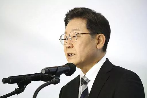 Lee Jae-myung, a candidate of the ruling Democratic Party for next March's presidential election, speaks during a New Year press conference at a Kia Motors' plant in Gyeonggi-do, South Korea Tuesday, Jan. 4, 2022.  (Chung Sung-Jun/Pool Photo via AP)