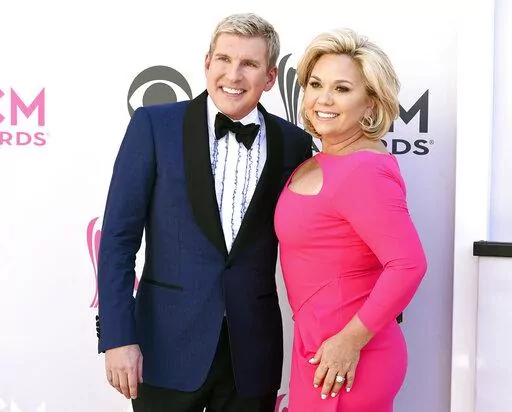 This April 2, 2017, photo shows Todd Chrisley, left, and his wife Julie Chrisley at the 52nd annual Academy of Country Music Awards in Las Vegas. A federal trial for reality television stars Todd and Julie Chrisley on charges including bank fraud and tax evasion is set to start Monday, May 16, 2022, in Atlanta. (Photo by Jordan Strauss/Invision/AP, File)