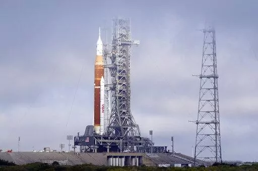 FILE -The NASA Artemis rocket with the Orion spacecraft aboard stands on pad 39B at the Kennedy Space Center in Cape Canaveral, Fla., March 18, 2022. After a series of equipment problems, NASA attempted an abbreviated fueling test of its mega moon rocket Thursday, April 14, 2022 at Florida's Kennedy Space Center. (AP Photo/John Raoux, File)