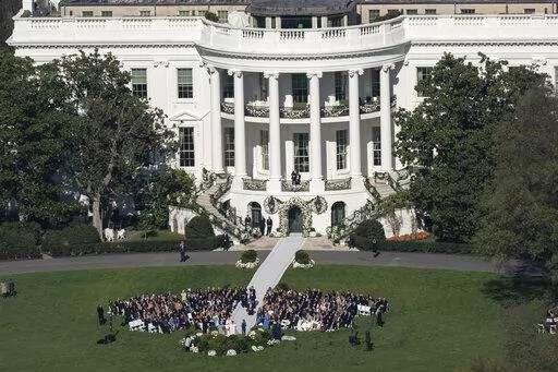 President Joe Biden's granddaughter Naomi Biden and her fiance, Peter Neal, are married on the South Lawn of the White House in Washington, Saturday, Nov. 19, 2022. (AP Photo/Carolyn Kaster)
