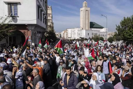 Thousands of Moroccans take part in a protest in solidarity with Palestinians in Gaza and against normalisation with Israel, in Casablanca, Morocco, Sunday, Oct. 29, 2023. Countries in the Middle East that have normalized or are considering normalizing relations with Israel are coming under growing public pressure to cut those ties because of Israel's war with Hamas. The protesters' demands present an uncomfortable dilemma for governments that have enjoyed the benefits of closer military and eco