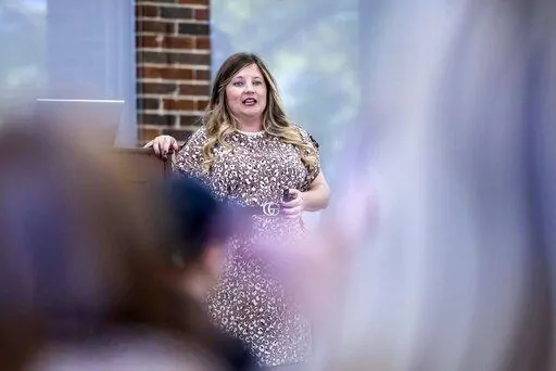 Paige Hicks, teacher and Athens City Educator (ACE) leader, discusses ethics scenarios as preservice teachers took an ethics seminar provided by the Athens State college of education, Tuesday, Oct. 11, 2022, in Athens, Ala. The seminar aimed to help prepare prospective teachers for real-world issues in the education workplace. (AP Photo/Vasha Hunt)