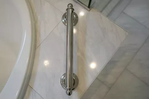 A grab bar next to the bathtub is shown in the recently remodeled home of Gene and Sallie Carr on Tuesday, May 7, 2024, in Hendersonville, N.C. An increasing number of Americans in their late 50s and older are staying in their houses, some by choice, others because they're locked into low mortgage rates that are too low to give up. (AP Photo/Chris Carlson)