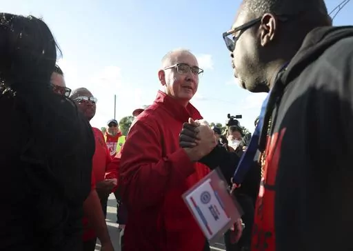 United Auto Workers President Shawn Fain, center, visits striking UAW Local 551 workers outside a Ford assembly center on South Burley Avenue on Oct. 7, 2023, in Chicago. Throughout its 5-week-old strikes against Detroit’s automakers, the United Auto Workers union has cast an emphatically combative stance, reflecting the style of Fain, its pugnacious leader. (John J. Kim /Chicago Tribune via AP, File)