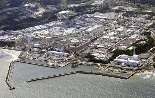 This aerial view shows the Fukushima Daiichi nuclear power plant, situated in coastal towns of both Okuma and Futaba, northeastern Japan, on Aug. 24, 2023, shortly after its operator Tokyo Electric Power Company Holdings TEPCO began releasing its first batch of treated radioactive water into the Pacific Ocean. Japan said Sunday, March 31, 2024, its experts have held talks with their Chinese counterparts to try to assuage Beijing’s concerns over the discharge of treated radioactive wastewater f
