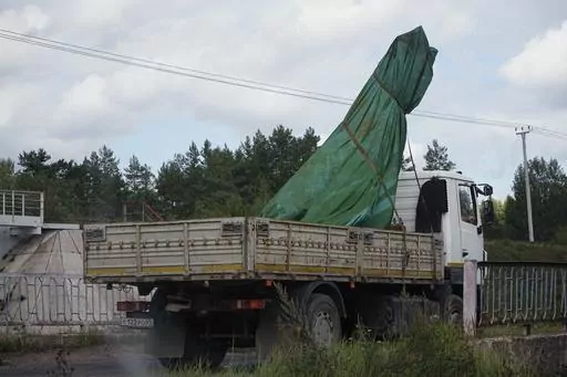 A truck carries a part of a private jet crashed near the village of Kuzhenkino, Tver region, Russia, Friday, Aug. 25, 2023. A preliminary U.S. intelligence assessment has found that the plane crash presumed to have killed Wagner leader Yevgeny Prigozhin was intentionally caused by an explosion. (AP Photo/Alexander Zemlianichenko)