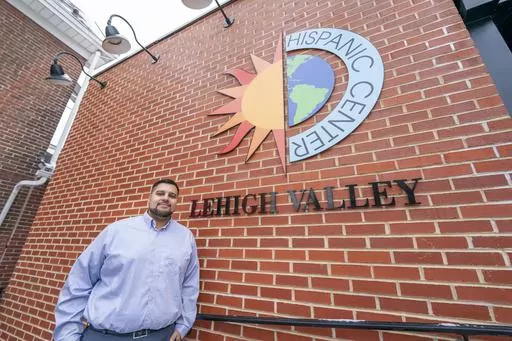 Raymond Santiago, executive director, Hispanic Center Lehigh Valley, poses for a photo during an interview, Thursday, Jan. 18, 2024, in Bethlehem, Penn. President Joe Biden is warning that Donald Trump will be a grave threat to American democracy if he wins re-election, but interviews with Pennsylvania voters again suggest it's not resonating. Santiago sees the recent 38% rise in use of the organization's food pantry as a stark sign of something he has felt over the past couple years: Many in th