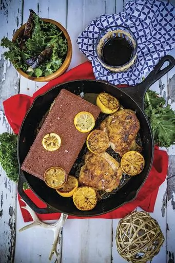 This image released by Ulysses Press shows a recipe for chicken under a brick. This recipe is fast and easy, and will add some victory points to your cooking game. It is gluten-free, sugar-free, dairy-free and low-fat. (Allyson Reedy and Greg McBoat/Ulysses Press via AP)