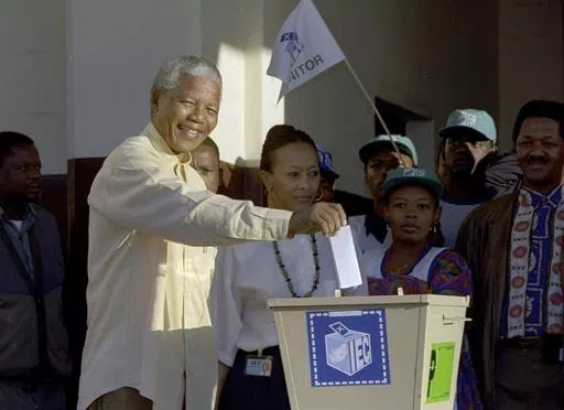 Then African National Congress leader, Nelson Mandela casts his vote April 27, 1994 near Durban, South Africa, in the country's first all-race elections. South Africans celebrate "Freedom Day" every April 27, when they remember their country's pivotal first democratic elections in 1994 that announced the official end of the racial segregation and oppression of apartheid. (AP Photo/John Parkin. File)