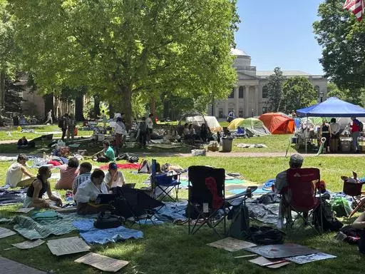 Students work on assignments and listen to organizers as they sit inside the encampment protest in Polk Place on University of North Carolina at Chapel Hill, N.C., April 29, 2024. On Monday, May 13, the University of North Carolina at Chapel Hill Board of Trustees approved a change that would divert $2.3 million of diversity funding to go toward public safety and policing. The vote to shift more funding to public safety comes as continued pro-Palestinian protests on UNC's campus have resulted in