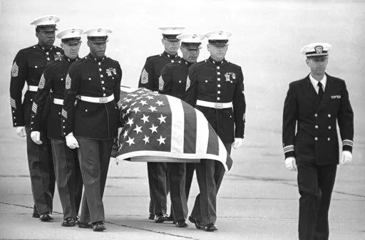 In this March 8, 1985, file photo, U.S. Marine Corps pallbearers carry the casket holding the body of slain U.S. Drug Enforcement agent Enrique Camarena Salazar after it arrived at North Island Naval Air Station, in San Diego. Mexican drug lord Rafael Caro Quintero was only ever sentenced in Mexico for the killing of Camarena and Mexican pilot Alfredo Zavala Avelar in 1985, but his gang apparently killed as many as six U.S. citizens in the western city of Guadalajara around the same time. (AP Ph