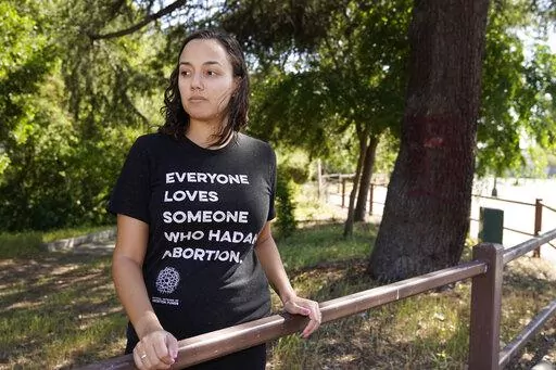 Jessica Pinckney poses at a park near her office in Oakland, Calif., Wednesday, May 4, 2022. California has one statewide abortion fund, known as Access Reproductive Justice. The group helps roughly 500 women each year, about a third whom come from other states, according to executive director Pinckney. (AP Photo/Eric Risberg)