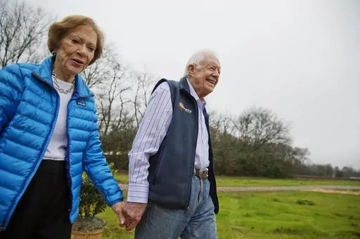 In this Feb. 8, 2017, file photo former President Jimmy Carter, right, and his wife Rosalynn arrive for a ribbon cutting ceremony for a solar panel project on farmland he owns in their hometown of Plains, Ga Jimmy and Rosalynn Carter have been best friends and life mates for nearly 80 years. Now with the former first lady's death at age 96, the former president must adjust to life without the woman who he credits as his equal partner in everything he accomplished in politics and as a global huma