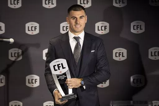 Toronto Argonauts' Chad Kelly poses with his award for Most Outstanding Player at the Canadian Football League Awards in Niagara Falls, Ontario, Thursday, Nov. 16, 2023. The CFL suspended Toronto Argonauts quarterback Chad Kelly for at least nine regular-season games Tuesday, May 7, 2024, following its investigation into a lawsuit filed by a former strength and conditioning coach against both the player and club.(Tara Walton/The Canadian Press via AP, File)