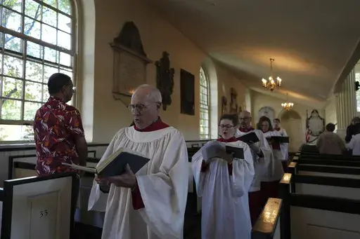 Choir members sing hymns at Christ Church in Philadelphia during Sunday service, Oct. 6, 2024. (AP Photo/Luis Andres Henao, File)