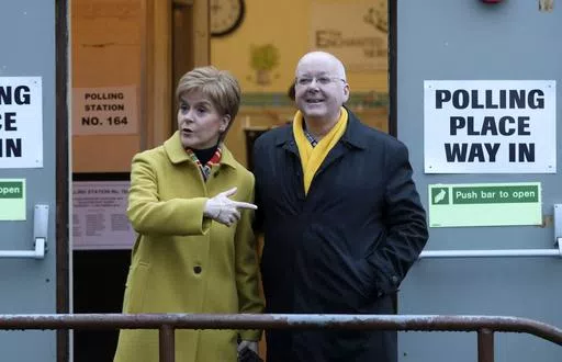 Scottish First Minister Nicola Sturgeon poses for the media with husband Peter Murrell, outside polling station in Glasgow, Scotland, on Dec. 12, 2019. The husband of former Scottish First Minister Nicola Sturgeon has been re-arrested in a probe into the finances of Scotland's pro-independence governing party. Police Scotland said a 59-year-old man had been taken into custody on Thursday, April 18, 2024 and was being questioned by detectives. While police did not name the suspect, the details pr