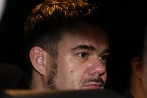 Dutch citizen Joran van der Sloot is driven in a police vehicle from a maximum-security prison to an airport to be extradited to the U.S., on the outskirts of Lima, Peru, Thursday, June 8, 2023. Van der Sloot, the chief suspect in Natalee Holloway’s 2005 disappearance, is scheduled to appear in court Wednesday morning, Oct. 18, where he is expected to plead guilty to trying to extort money from her mother and provide new information about what happened to the missing teen. (AP Photo/Martin Mej