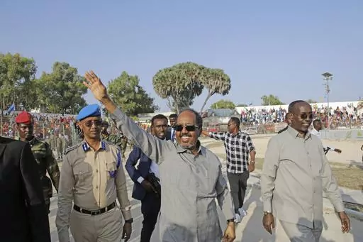 Somalia President Hassan Sheikh Mohamud leads a demonstration at Banadir stadium, Mogadishu, Thursday Jan. 12, 2023. The government rally encouraged an uprising against the al-Shabab group amid a month-long military offensive. The African Union appealed for nearly $90 million Wednesday, March 22, 2023, for its peacekeeping force in Somalia, which is providing support to its military forces battling al-Shabab extremists. (AP Photo/Farah Abdi Warsameh, File)