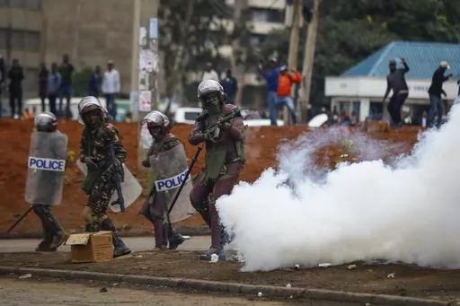 Riot police fire tear gas grenades at demonstrators during protests in the capital Nairobi, Kenya on July 7, 2023. The United States is praising Kenya's interest in leading a multinational force in Haiti. But weeks ago, the U.S. openly warned Kenyan police officers against violent abuses. Now 1,000 of those police officers might head to Haiti to take on gang warfare. (AP Photo/Brian Inganga, File)