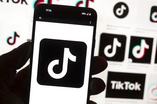 The TikTok logo is seen on a cell phone on Oct. 14, 2022, in Boston. On Thursday, Jan. 12, 2023, Wisconsin became the latest state to ban the use of TikTok on state phones and other devices, a move that comes amid a push for a federal ban and after nearly half of the states nationwide have blocked the popular app. (AP Photo/Michael Dwyer, File)