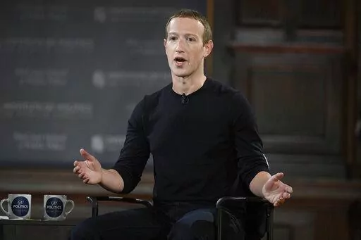 Facebook CEO Mark Zuckerberg speaks at Georgetown University in Washington, Thursday, Oct. 17, 2019. Facebook parent Meta is laying off 11,000 people, about 13% of its workforce, as it contends with faltering revenue and broader tech industry woes, Zuckerberg said in a letter to employees Wednesday. (AP Photo/Nick Wass, File)