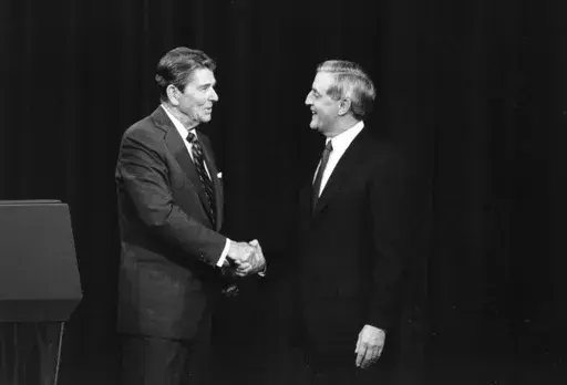 President Ronald Reagan, left, and his Democratic challenger Walter Mondale, shake hands before debating in Kansas City, Mo., Oct. 22, 1984. The age question for presidential candidates is more than four decades old. (AP Photo/Ron Edmonds, File)
