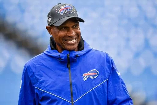 FILE - Buffalo Bills defensive coordinator Leslie Frazier walks on the field before an NFL football game against the Houston Texans, on Oct. 3, 2021, in Orchard Park, N.Y. Frazier is credited for providing the Bills a calm and reassuring voice even at the the most troubling times. (AP Photo/Adrian Kraus, File)