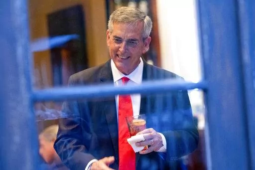Georgia Secretary of State Brad Raffensperger talks with supporters during an election night party on May 24, 2022, at a restaurant in Peachtree Corners, Ga. (AP Photo/Ben Gray, File)
