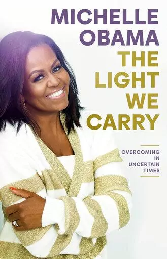 This image released by Random House shows "The Light We Carry" by former first lady and author Michelle Obama. (Random House via AP)