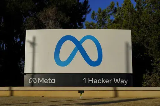 Meta's logo can be seen on a sign at the company's headquarters in Menlo Park, Calif., on Nov. 9, 2022. Irish regulators on Wednesday Jan. 4, 2023 hit Facebook parent Meta with hundreds of millions in fines and banned the company from forcing European users to agree to seeing personalized ads based on their online activity. (AP Photo/Godofredo A. Vásquez, File)