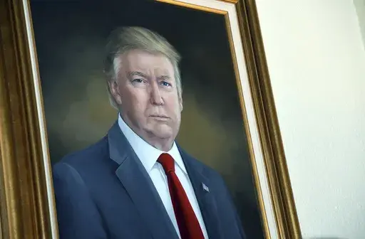 President Donald Trump's portrait hangs in the Colorado Capitol after an unveiling ceremony, Aug. 1, 2019, in Denver. (AP Photo/Thomas Peipert, File)