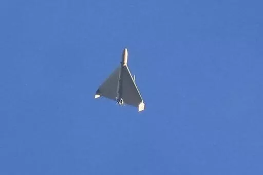 A drone is seen in the sky seconds before it fired on buildings in Kyiv, Ukraine, Monday, Oct. 17, 2022. (AP Photo/Efrem Lukatsky)