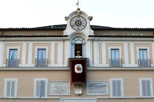 Pope Benedict XVI greets faithful from his summer residence of Castel Gandolfo, the scenic town where he spent his first post-Vatican days and made his last public blessing as pope, Feb. 28, 2013. Pope Emeritus Benedict XVI's death has hit Castel Gandolfo's "castellani" particularly hard, since many knew him personally, and in some ways had already bid him an emotional farewell when he uttered his final words as pope from the palace balcony overlooking the town square. (AP Photo/Luca Bruno, File