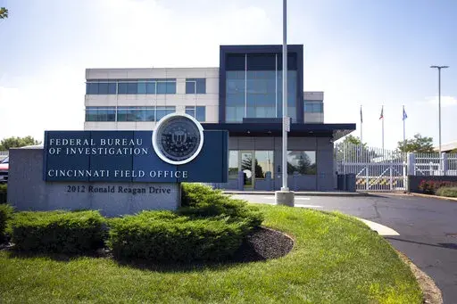 The entrance to the FBI headquarters in Cincinnati, on Aug. 11, 2022. An armed man decked out in body armor tried to breach a security screening area at the FBI field office. Federal authorities and experts who study online extremism are warning of the risk of additional attacks on federal law enforcement following the FBI's search of ex-President Donald Trump's Florida home, Mar-a-Lago. (Liz Dufour/The Cincinnati Enquirer via AP, File)
