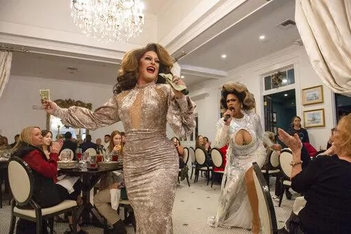Drag queens Ivy Dripp and Lexis Redd D'ville open drag brunch at White Pillars in Gulfport, Miss., on Sunday, Dec. 19, 2021. Nearly everyone involved in the always-sold-out monthly drag brunches at White Pillars agree the set-up seems improbable. This is the Deep South, and White Pillars has been “an icon” on the Coast for so long. (Hannah Ruhoff/The Sun Herald via AP)