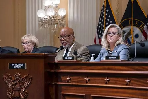Chairman Bennie Thompson, D-Miss., center, flanked by Rep. Zoe Lofgren, D-Calif., left, and Vice Chair Liz Cheney, R-Wyo., makes a statement as the House committee investigating the Jan. 6 attack on the U.S. Capitol pushes ahead with contempt charges against former advisers to Donald Trump, Peter Navarro and Dan Scavino, in response to their refusal to comply with subpoenas, at the Capitol in Washington, Monday, March 28, 2022. Navarro, President Donald Trump's trade adviser, and Scavino, a Whit