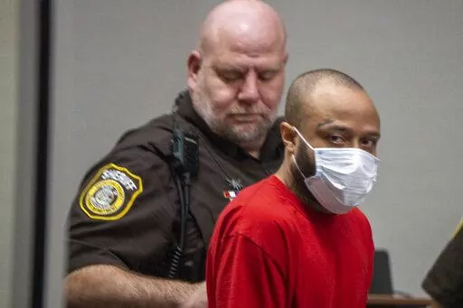 Darrell Brooks Jr. appears in Waukesha County court on Friday, Feb. 11, 2022 in Waukesha, Wis. Brooks Jr., accused of driving his SUV through a Christmas parade in suburban Milwaukee last year, killing six people and injuring dozens more, this week served notice he will try to persuade a jury that he was mentally ill during the incident and if convicted should go to an institution instead of prison. (Derek Johnson/Waukesha Freeman via AP, Pool File)