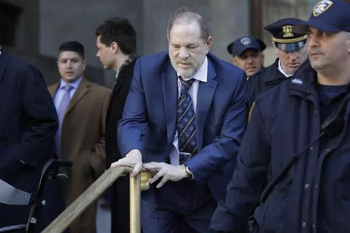 Harvey Weinstein leaves a Manhattan courthouse after closing arguments in his rape trial in New York, Friday, Feb. 14, 2020. New York's highest court has overturned Harvey Weinstein's 2020 rape conviction and ordered a new trial. (AP Photo/Seth Wenig, File)