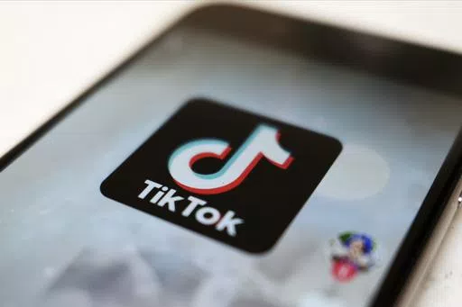 The TikTok logo is displayed on a smartphone screen in Tokyo on Sept. 28, 2020. TikTok says it's going to start automatically labeling content that's made by artificial intelligence when it's uploaded from certain platforms. TikTok says its efforts are an attempt to combat misinformation from being spread on its social media platform. The announcement came on ABC's “Good Morning America” on Thursday, May 9, 2024. (AP Photo/Kiichiro Sato, File)