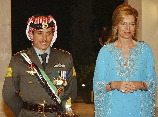Then Crown Prince Hamzeh of Jordan, left, with his mother Queen Noor, during his wedding ceremony in Amman, Jordan, May 27, 2004. King Abdullah II of Jordan has gone public with a royal rift with his half-brother Prince Hamzeh and formalized the former crown prince's house arrest, calling him “erratic” in an unprecedented harsh-worded public letter published Thursday, May 19, 2022. The king said in a public letter that he had approved measures to detain Prince Hamzah in his palace and restri