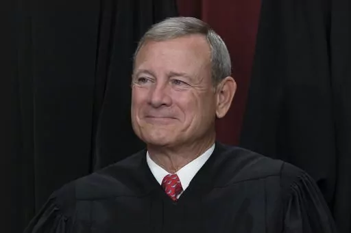 Chief Justice of the United States John Roberts joins other members of the Supreme Court as they pose for a new group portrait, at the Supreme Court building in Washington, Friday, Oct. 7, 2022. (AP Photo/J. Scott Applewhite, File)