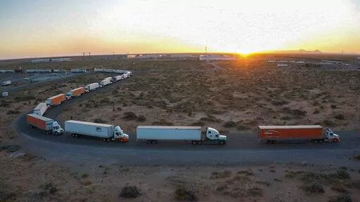 Truckers block the entrance into the Santa Teresa Port of Entry in Ciudad Juarez going into New Mexico on April 12, 2022. The truckers blocked the port as a protest to the prolonged processing times implemented by Gov. Abbott which they say have increased from 2-3 hours up to 14 hours in the last few days. (Omar Ornelas /The El Paso Times via AP)