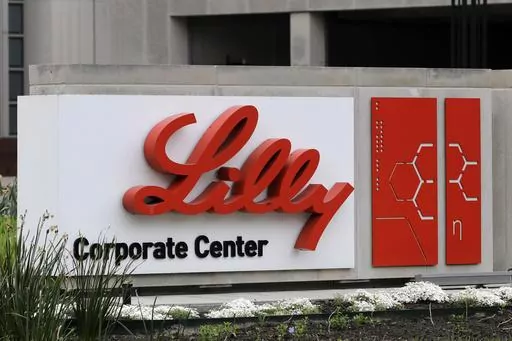 A sign for Eli Lilly & Co. sits outside their corporate headquarters in Indianapolis on April 26, 2017. New research shows another experimental Alzheimer's drug can modestly slow patients' inevitable worsening. Patients given monthly infusions of Eli Lilly and Co.'s donanemab declined about four to seven months more slowly than those given dummy infusions in a large study. (AP Photo/Darron Cummings, File)