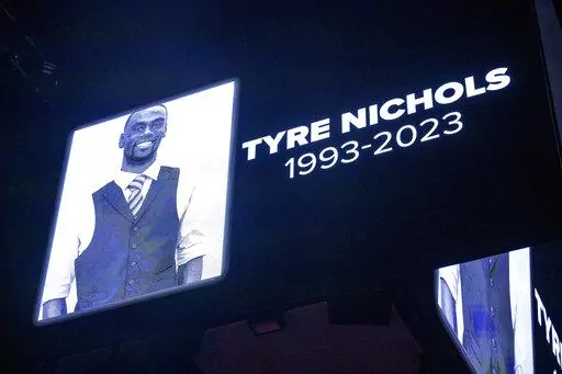 The screen at the Smoothie King Center in New Orleans honors Tyre Nichols before an NBA basketball game between the New Orleans Pelicans and the Washington Wizards, Saturday, Jan. 28, 2023. Officials said late Wednesday, Feb. 15, that two sheriff's deputies who have been suspended for five days for their role in the arrest of Nichols failed to keep their body cameras activated after they went to the location where Nichols had been beaten by five Memphis police officers. (AP Photo/Matthew Hinton,