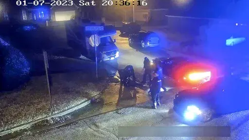 In this image from video released and partially redacted by the city of Memphis, Tenn., Tyre Nichols lies on the ground during a brutal attack by Memphis Police officers on Jan. 7, 2023, in Memphis. Officials said Tuesday, Feb. 7, that a total of 13 Memphis officers could end up being disciplined in connection with the violent arrest of Nichols, as city council members expressed frustration with the city’s police and fire chiefs during a meeting for not moving quickly on specific policy reform