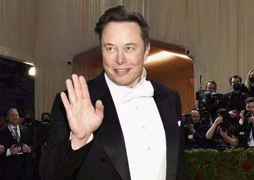 Elon Musk attends The Metropolitan Museum of Art's Costume Institute benefit gala on May 2, 2022, in New York. Musk threatened to walk away from his $44 billion bid to buy Twitter on Monday, June 6, 2022, the latest sign that his plan to overhaul the social media platform may be really starting to fray. (Photo by Evan Agostini/Invision/AP, File)