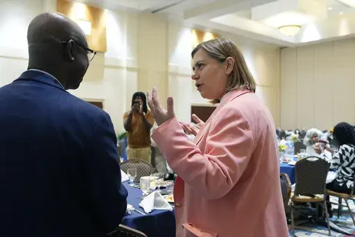 U.S. Senate candidate, Rep. Elissa Slotkin, D-Mich., talks with faith and community leaders at the Greater Grace Temple, Friday, Aug. 2, 2024, in Detroit. (AP Photo/Carlos Osorio)