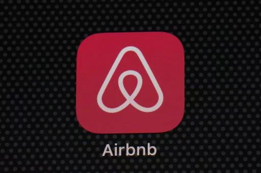 The Airbnb app icon is displayed on an iPad screen in Washington, D.C., on May 8, 2021. Airbnb says it’s banning the use of indoor security cameras in listings around the world by the end of next month. The San Francisco-based online rental platform said it making the change to simplify its security camera policy and continue efforts to prioritize privacy. (AP Photo/Patrick Semansky, File)